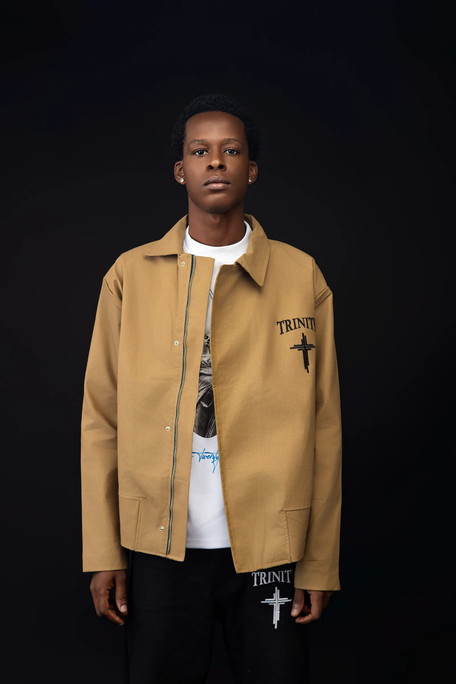 Male model wearing the tan jacket