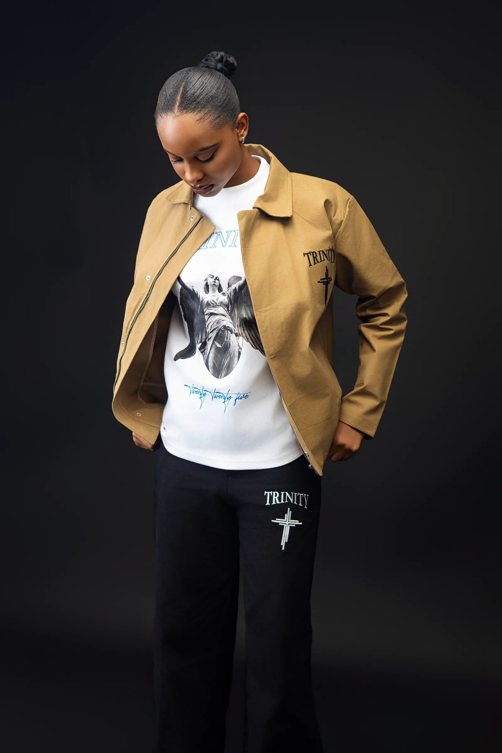 Female model wearing the same tan jacket